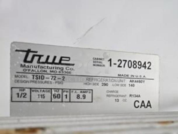 True TSID-72-2 refrigerated display case label, shows model and serial number 1-2708942, 115V, R134A refrigerant.