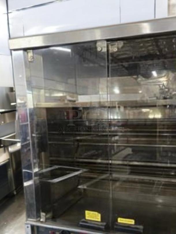 Robot Coupe commercial electric rotisserie oven in outstanding condition, fully tested and working. Glass doors, stainless steel finish.