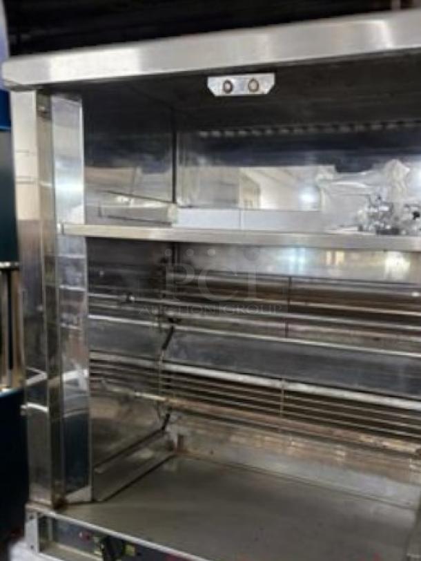 Robot Coupe commercial electric rotisserie oven in outstanding condition; fully tested and working, stainless steel exterior.
