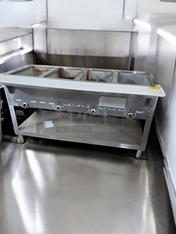 Duke E304SW electric steam table, four wells, 208V, great condition, infinite controls, stainless steel, fully tested.