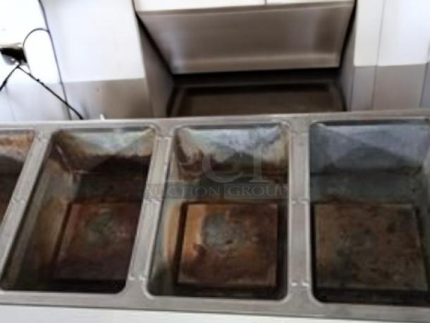 Duke E304SW electric steam table, four wells, 208V, in great condition, fully tested.