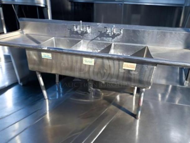Stainless steel 3-compartment sink with dual drainboards, NSF certified, model 3CS-182414-2D, excellent condition.