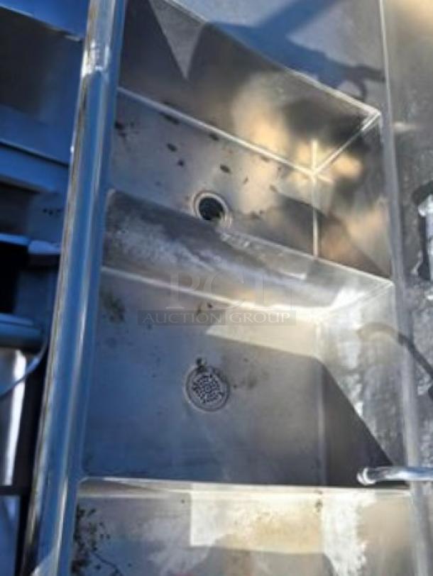 Stainless steel 3-compartment sink with dual drainboards, NSF certified, Advance Tabco 3CS-182414-2D, excellent condition.