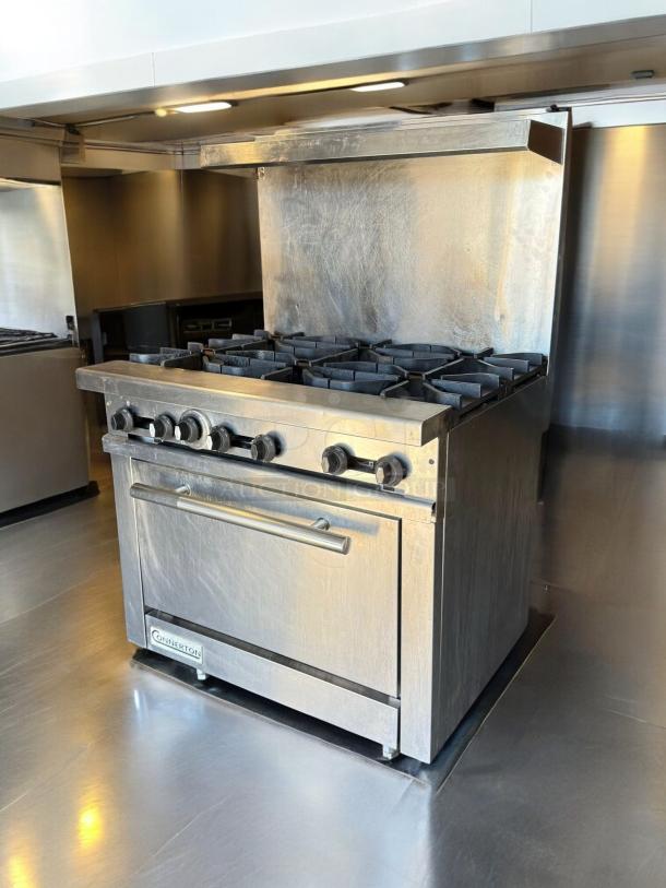 Connerton CR-6 6-burner gas range with oven; stainless steel; natural gas; outstanding condition; fully tested and working.