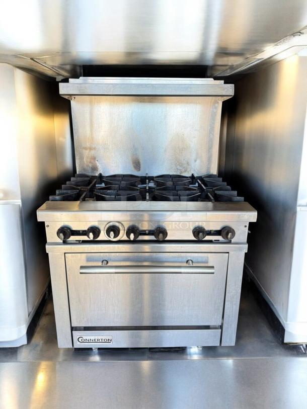 Connerton CR-6 gas range with 6 burners, standard oven, stainless steel finish, pristine condition, natural gas, tested.