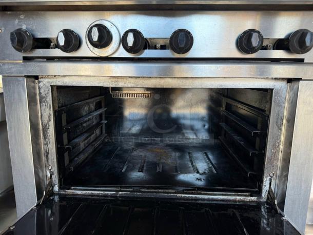 Connerton CR-6 gas range with six burners and standard oven, stainless steel, knobs intact, fully tested, natural gas.