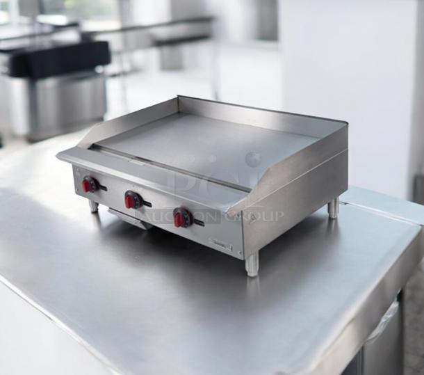 Kintera KG-36, 36" commercial gas griddle in prime condition, features three red control knobs; natural gas; fully tested.