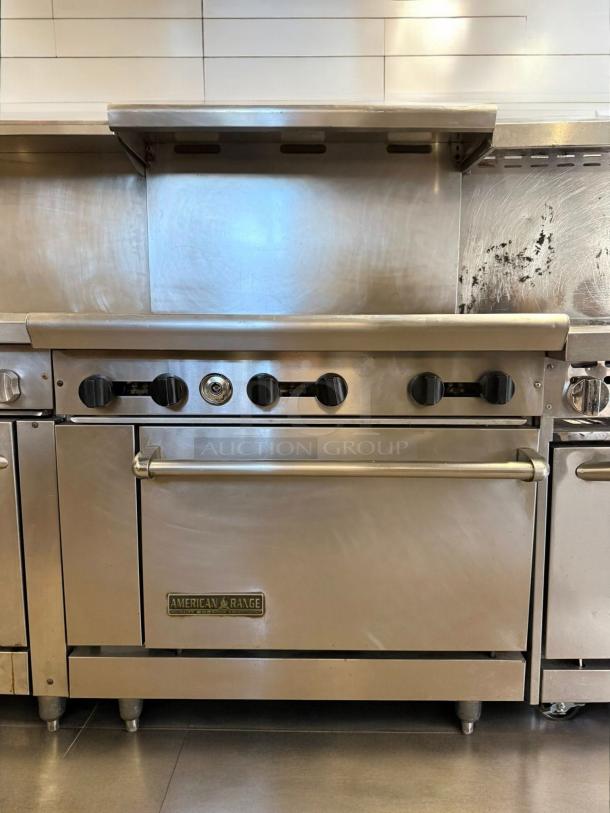 American Range AR-10, 10-burner gas range with double ovens, superb condition, natural gas, stainless steel finish, branded logo visible.