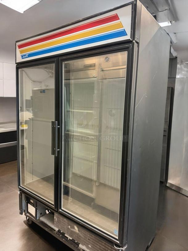 True GDM-49F-LD double door glass freezer in outstanding condition. Fully tested, works on 115/208-230V, with brand logo visible.