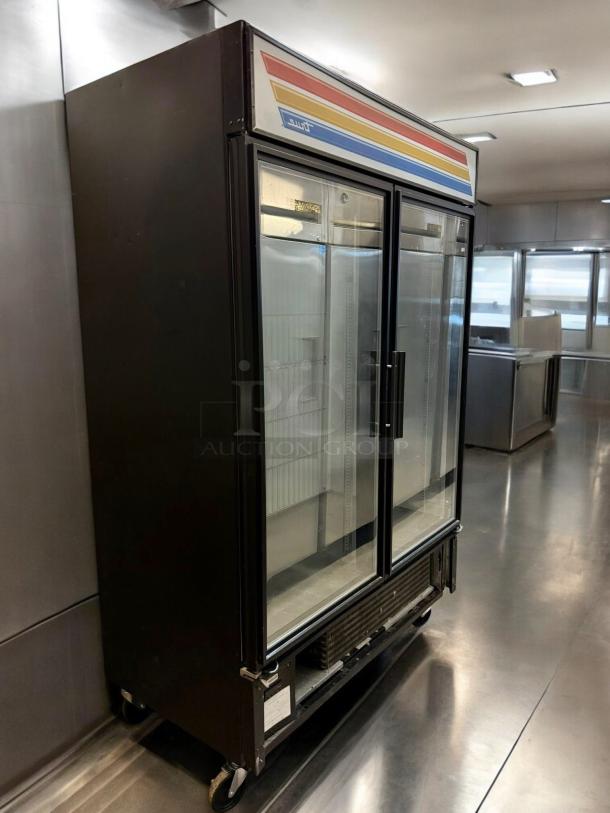 True GDM-49F-LD double door glass freezer merchandiser in outstanding condition. Fully tested, 115/208-230V. Made in USA.