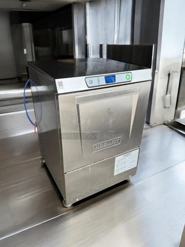 Pristine Hobart LXPH undercounter dishwasher, 208-240V, stainless steel, fully tested. Often includes QR code and Hobart label.