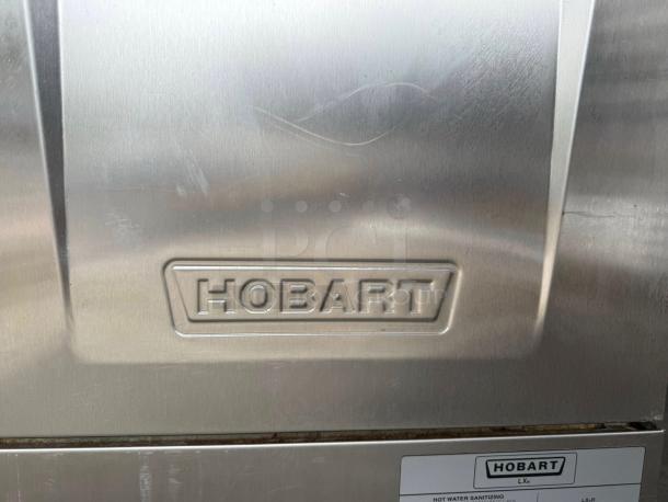Hobart LXPH commercial undercounter dishwasher in pristine condition, 208-240V, with visible brand logo. Fully tested.
