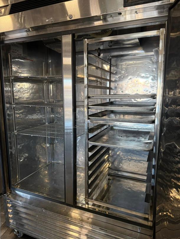 True T-49-HC double door reach-in refrigerator in superb condition, stainless steel, fully tested, 115V, shelves included.