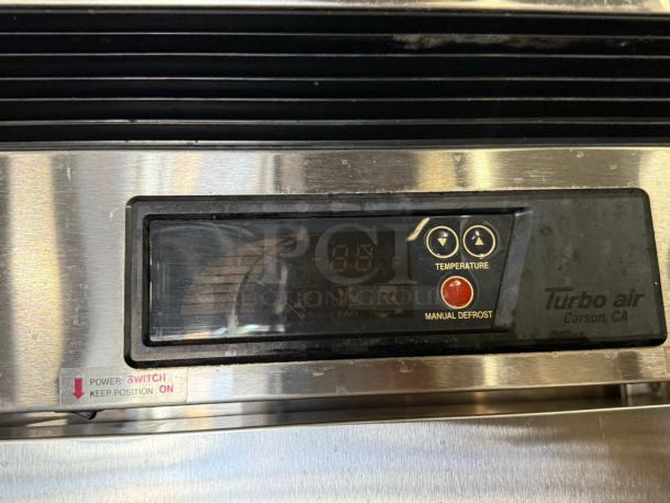 True T-49-HC refrigerator control panel, showing temperature display and manual defrost button.
