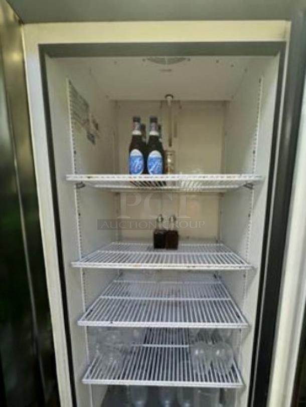 True GDM-23-HC-LD glass door merchandising refrigerator, immaculate condition, 115V, fully tested, 5 adjustable shelves.