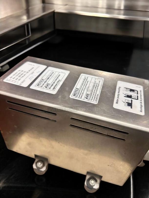 Schaerer Coffee Art Plus espresso machine, excellent condition, showing side panel with warning labels and 208-240V marking.