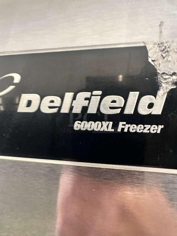 Delfield 6000XL double door reach-in freezer in superb condition, label shows model and working status, 115V, commercial use.
