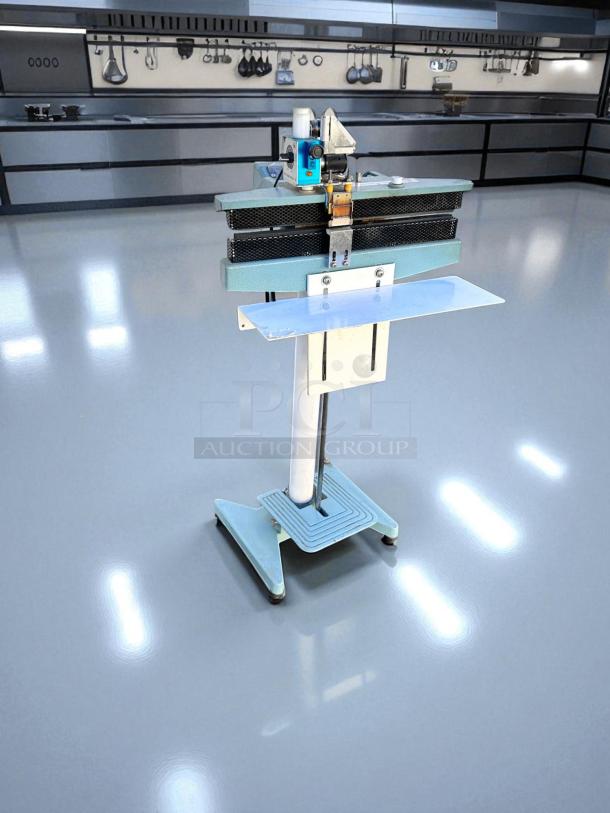 AIE ME-400CFN heat sealer in excellent condition, 420W, 115V, fully tested, freestanding unit with blue base and metallic components.