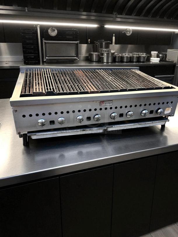 Wolf 48" gas countertop radiant charbroiler in excellent condition. Features multiple control knobs, fully tested and working.