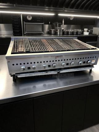 Wolf 48" gas countertop radiant charbroiler in excellent condition. Features multiple control knobs, fully tested and working.
