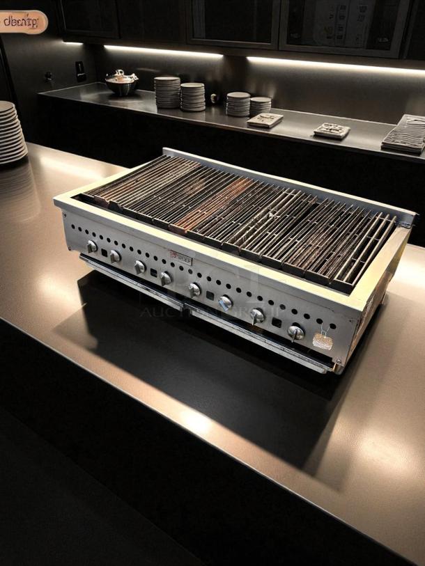 Wolf Radiant Charbroiler 48" gas countertop grill in excellent condition. Features durable grates, multiple control knobs, fully tested.