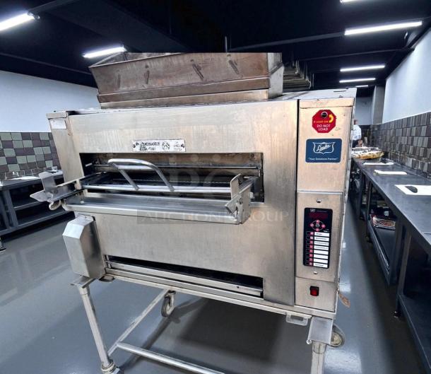 Duke FBB-NC-120 gas conveyor broiler in excellent condition. Used in Burger King, fully tested and working. Visible brand label.