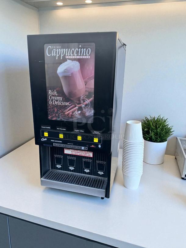 Wilbur Curtis PC-4D-10-01 4-flavor cappuccino machine, excellent condition, 120V, fully tested, black finish, branded display.