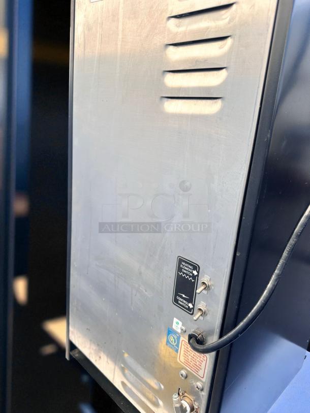 Wilbur Curtis PC-4D-10-01 cappuccino machine, 4-flavor, 120V, stainless steel, excellent condition, fully tested.