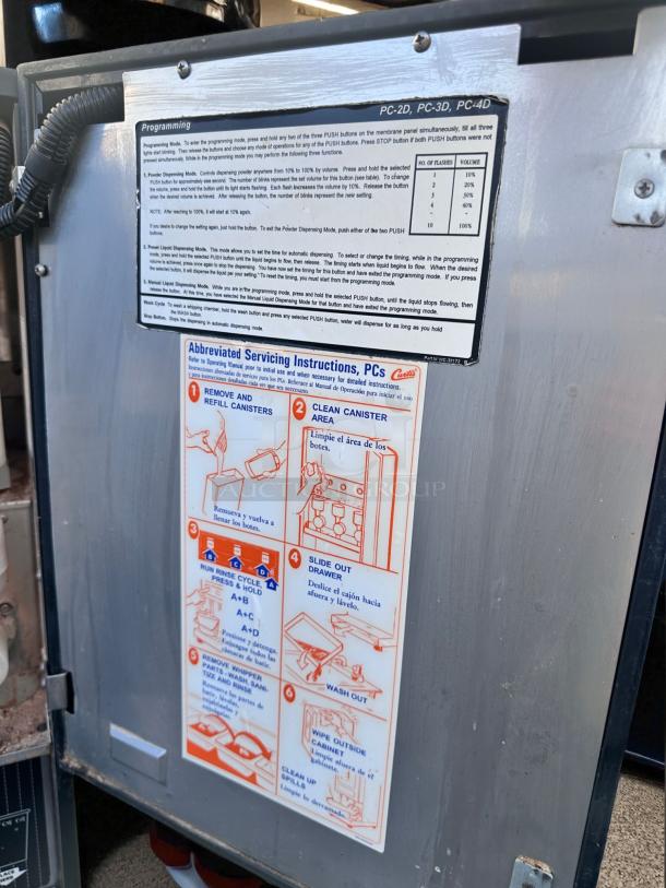 Wilbur Curtis PC-4D-10-01 cappuccino machine, 4-flavor, 120V, excellent condition, fully tested. Instructional labels visible.