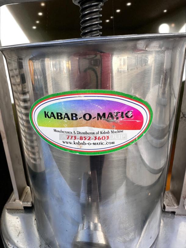 Immaculate Kabab-O-Matic manual vertical kebab press, stainless steel, fully tested, visible brand label, mint condition.