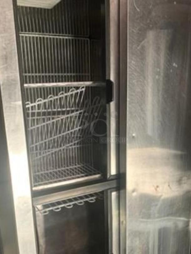 Turbo Air TBC-50SB-N6 bottle cooler in excellent condition, 50" wide, 115V. Visible shelving, stainless steel body. Fully tested.
