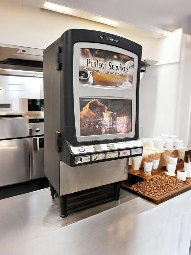 Perfect Servings coffee condiment dispenser on a countertop in a well-lit kitchen.