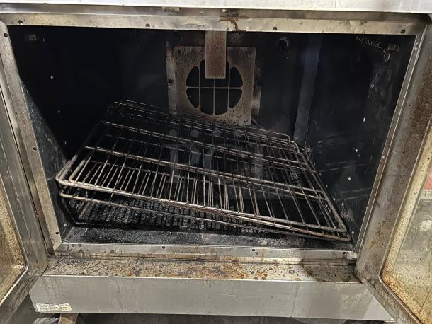 WOLF WKGD-2 double deck gas convection oven, excellent condition, tested and working, interior view with racks visible.