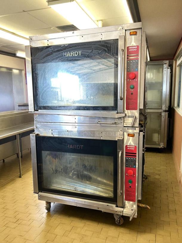 Double stacked Hardt Inferno 4500 gas rotisserie oven in excellent condition, fully tested, stainless steel, model labeled.