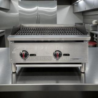 Kintera KCBR24 24" gas countertop charbroiler with 2 burners, shown in stainless steel. Features heat control knobs; tested and working.