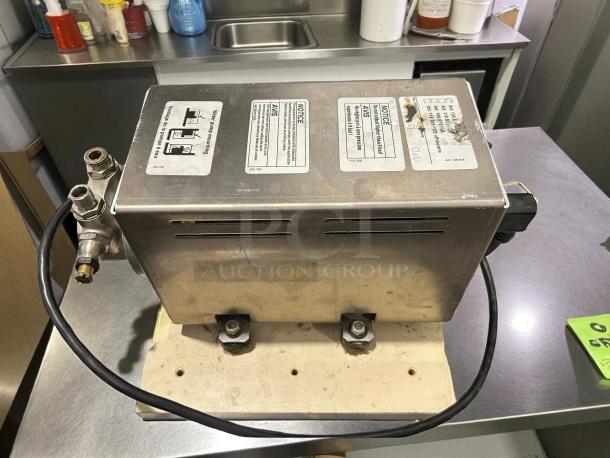 Thermoplan Mastrena II espresso machine with external pump, 220V/3PH. Commercial use, metal casing, visible labels, fully tested.