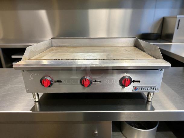 Kintera KGR36T 36" countertop griddle, natural gas, 3 burners, tested and working, great condition, visible logo.