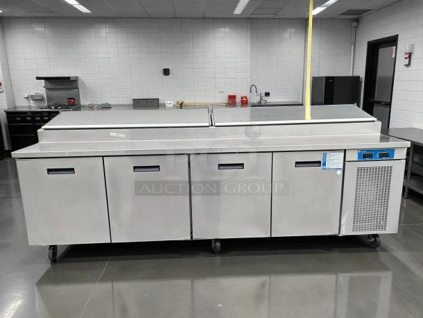 Randell 84111N-290 110" pizza prep table with 4 doors and refrigerated base. Stainless steel, tested, and in working condition.