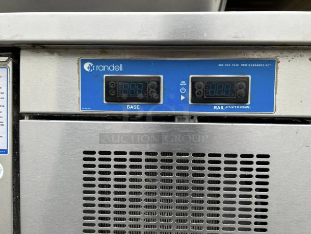 Randell 84111N-290 pizza prep table control panel, displaying temperature settings. Stainless steel exterior visible.