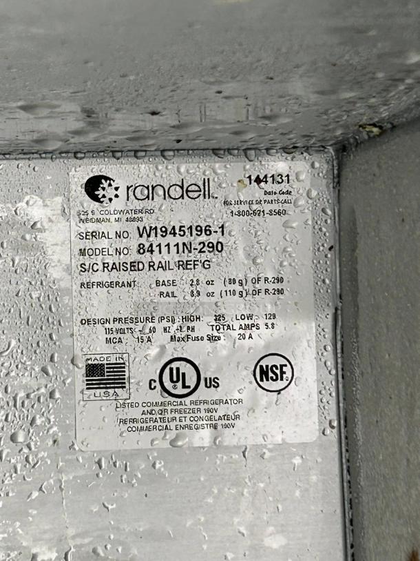 Randell 84111N-290 110" 4 Door Pizza Prep Table label. Features refrigerant details, UL and NSF certifications, Made in USA.
