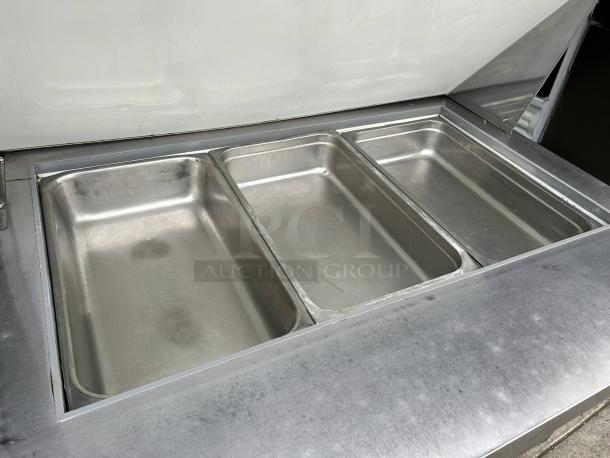 Falcon AST-36 36" sandwich prep table with stainless steel pans. Tested and working, in good condition. Ideal for food service.