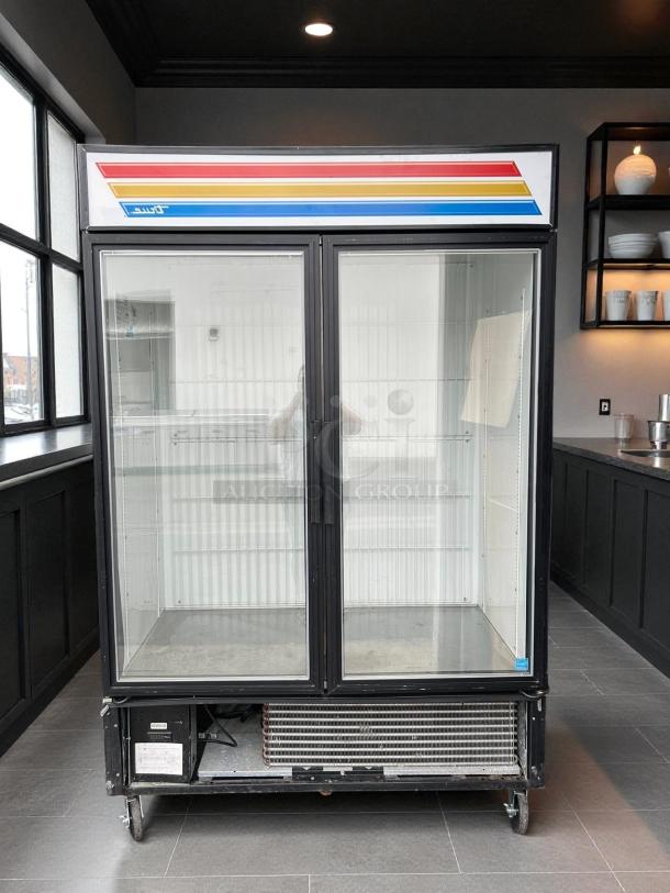 True GDM-49F-FLX-HC~TSL01 glass door merchandiser, black, excellent condition, two-section, 54 1/8", tested, 115v.