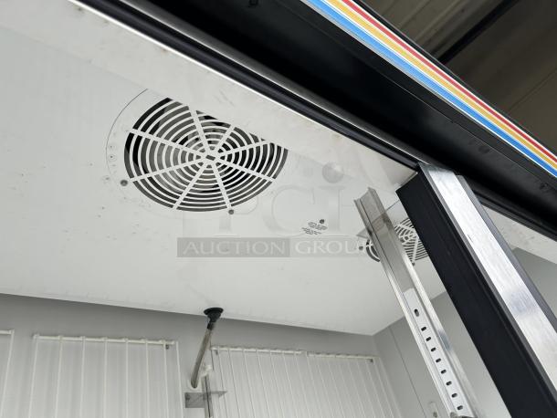 True GDM-49F-FLX-HC~TSL01 glass door merchandiser, black, two-section, excellent condition, tested and working, 115v.