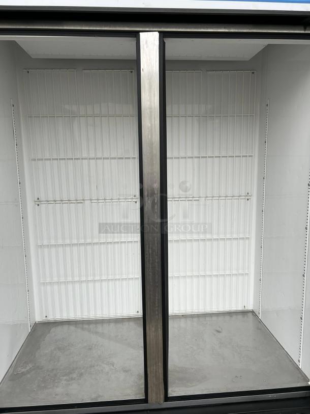 True GDM-49F-FLX-HC~TSL01 glass door merchandiser, 54 1/8", two-section, black, excellent condition, tested and working.