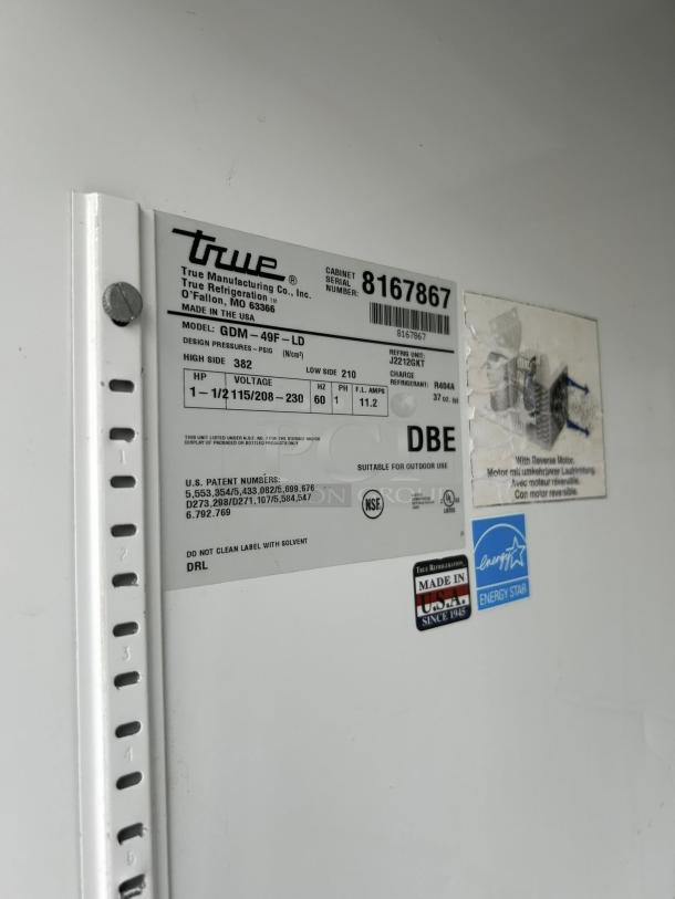 True GDM-49F-FLX-HC~TSL01 label showing model, serial number, voltage, and certifications. Made in USA. Energy Star certified.