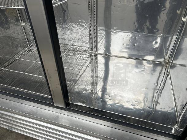 Turbo Air TSF-49SD-N Super Deluxe 54" reach-in freezer interior, showing clean metal shelves and reflective surfaces.