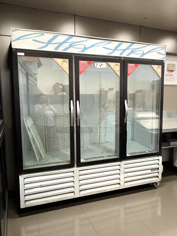 Beverage-Air CRG74-1 78" glass door refrigerated merchandiser, three sections, working condition, visible signage.