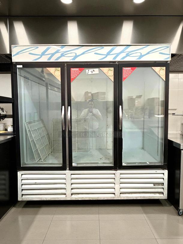 Beverage-Air CRG74-1, 78" three-section glass door refrigerated merchandiser; tested, working, slight wear, includes shelves.