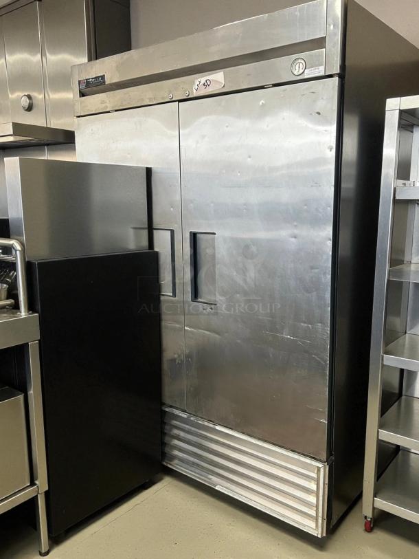 True T-49F-HC reach-in freezer, excellent condition, tested and working. Features solid doors, stainless steel finish.