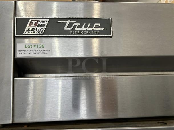 True T-72-HC solid door reach-in refrigerator in great condition showing front with True logo and lot sticker.